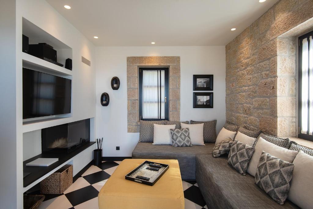 A television and/or entertainment centre at Polismata - Private Residences