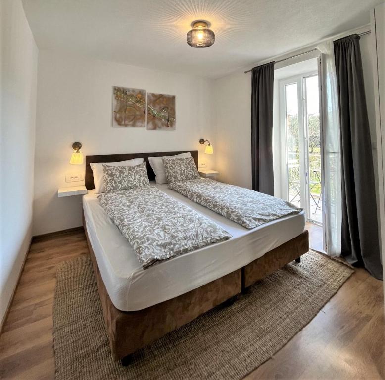 Postel nebo postele na pokoji v ubytování Apartment Lorun 47