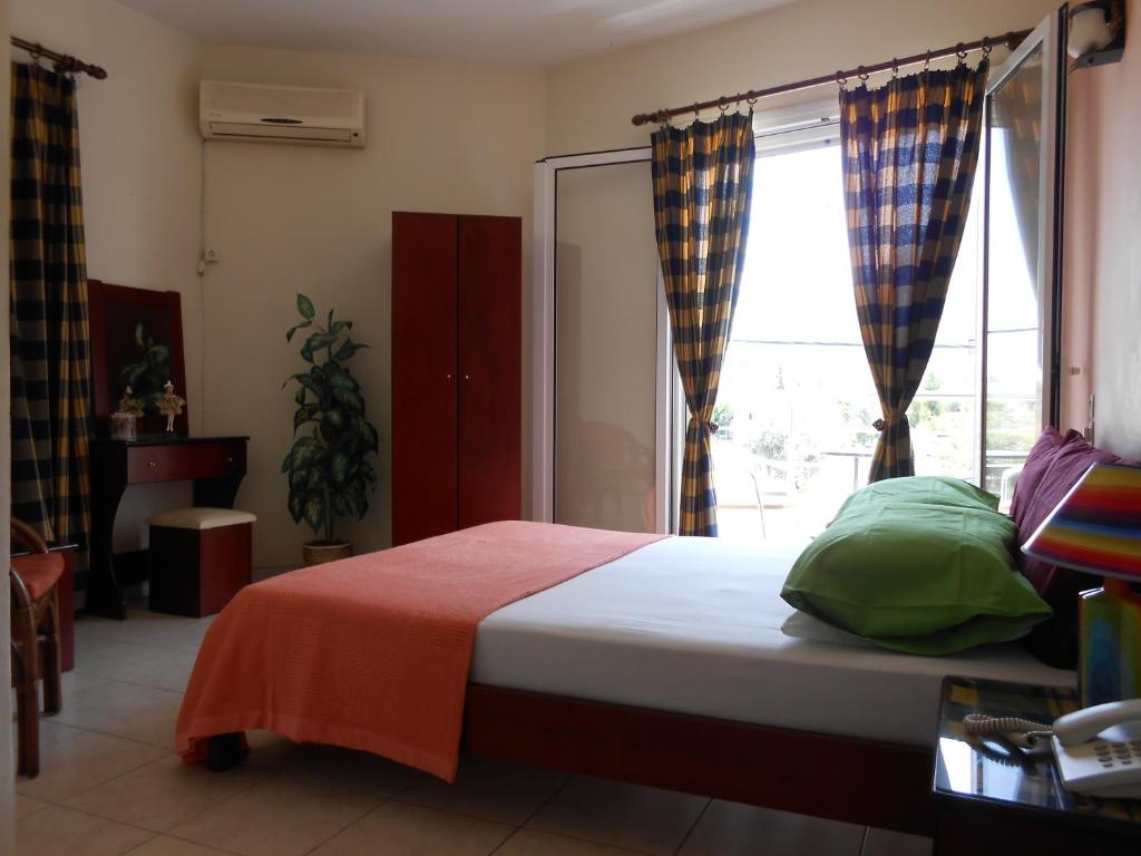 Postel nebo postele na pokoji v ubytování Hotel Neon Astron