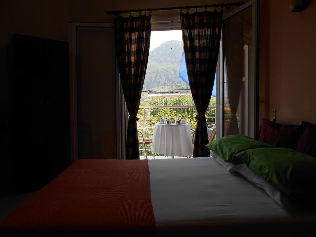 Postel nebo postele na pokoji v ubytování Hotel Neon Astron