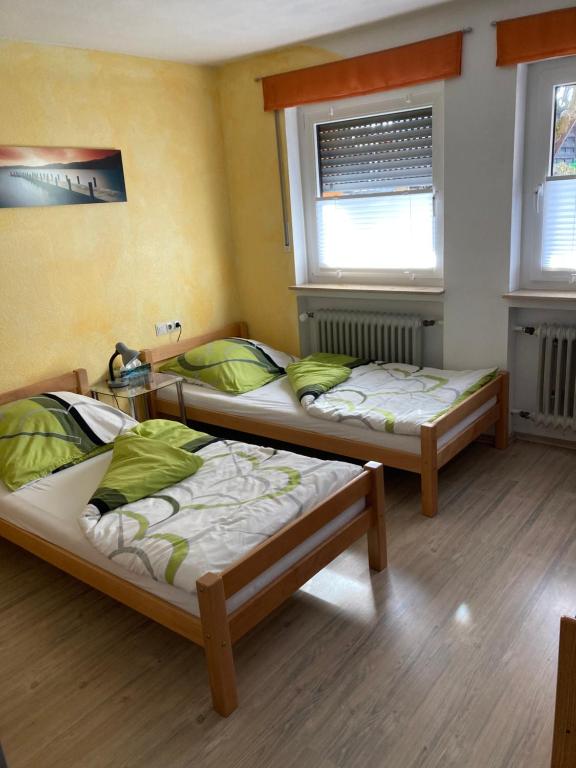A bed or beds in a room at Ferienwohnung Schwarz