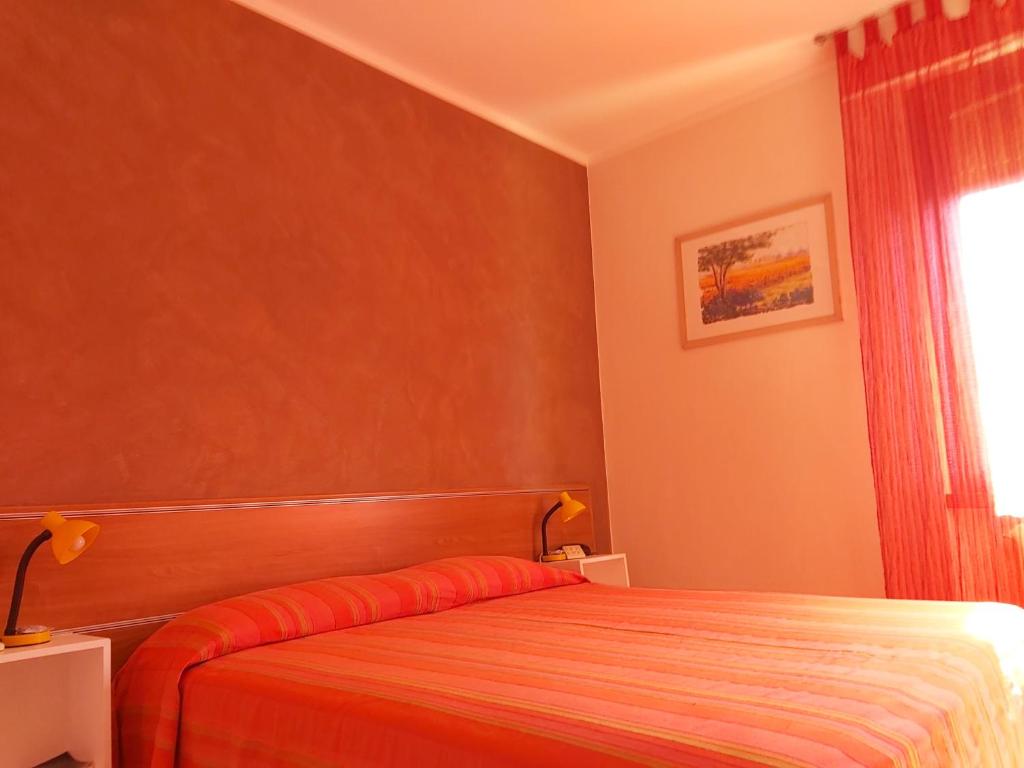 Postel nebo postele na pokoji v ubytování Hotel La Passeggiata
