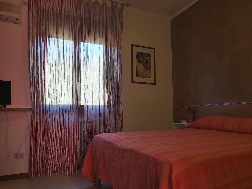 Postel nebo postele na pokoji v ubytování Hotel La Passeggiata