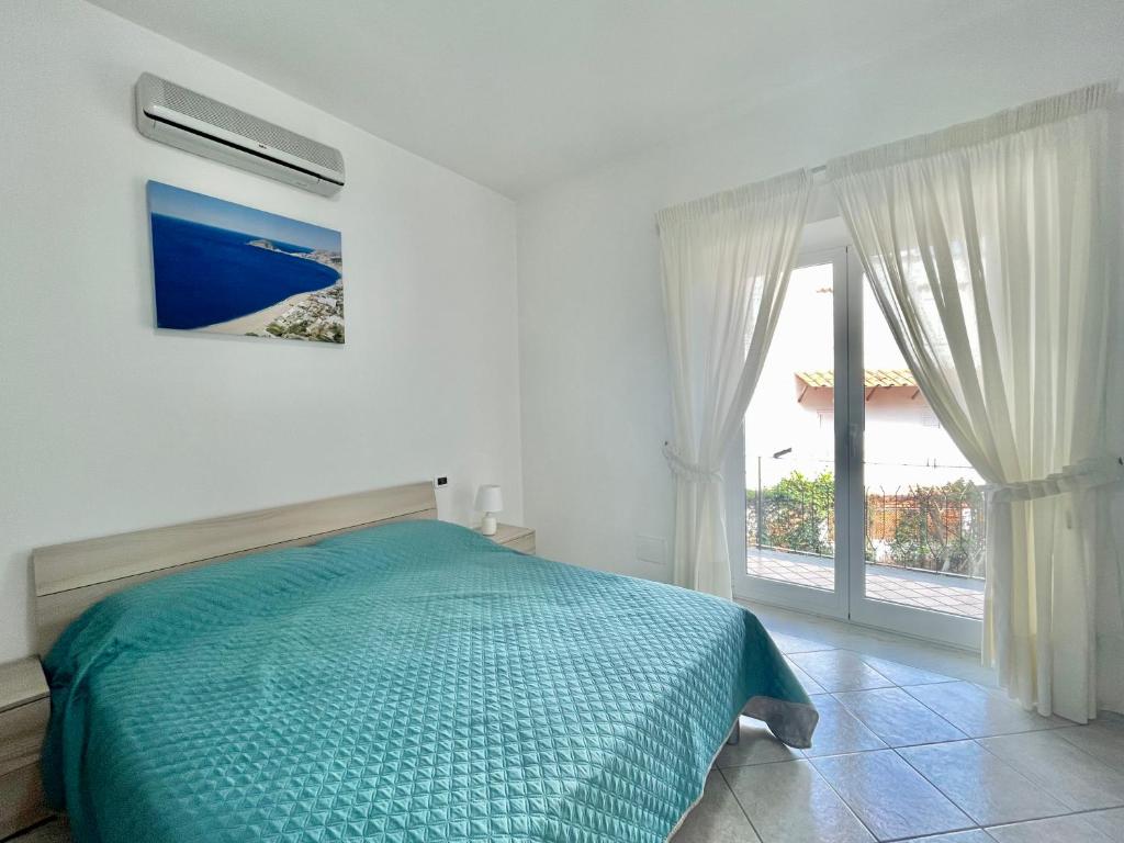 A bed or beds in a room at CASA VACANZE MARIAFRANCESCA