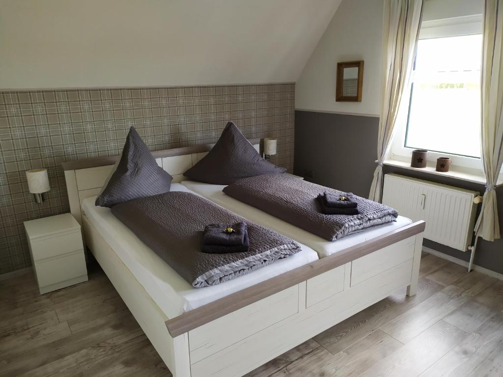 Postel nebo postele na pokoji v ubytování Ferienwohnung Zeit für uns