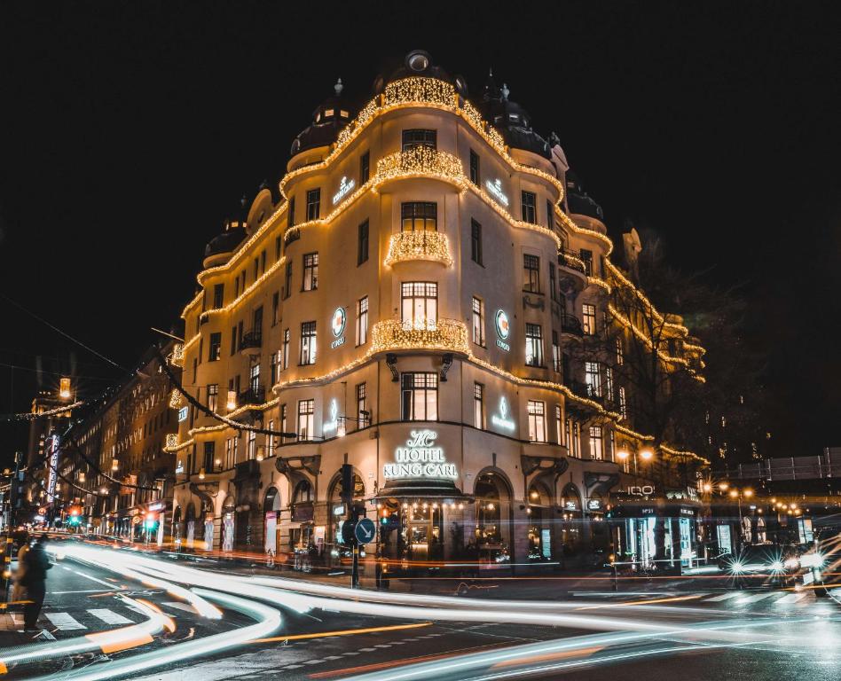 a large building on a city street at night at Hotel Kung Carl, WorldHotels Crafted in Stockholm