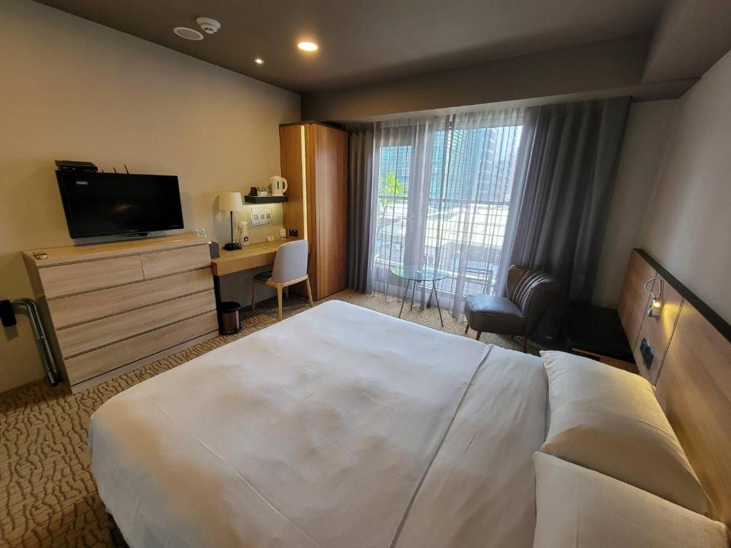 Postel nebo postele na pokoji v ubytování Simple + Hotel