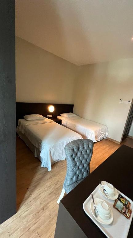 Postel nebo postele na pokoji v ubytování Tanjung Villa