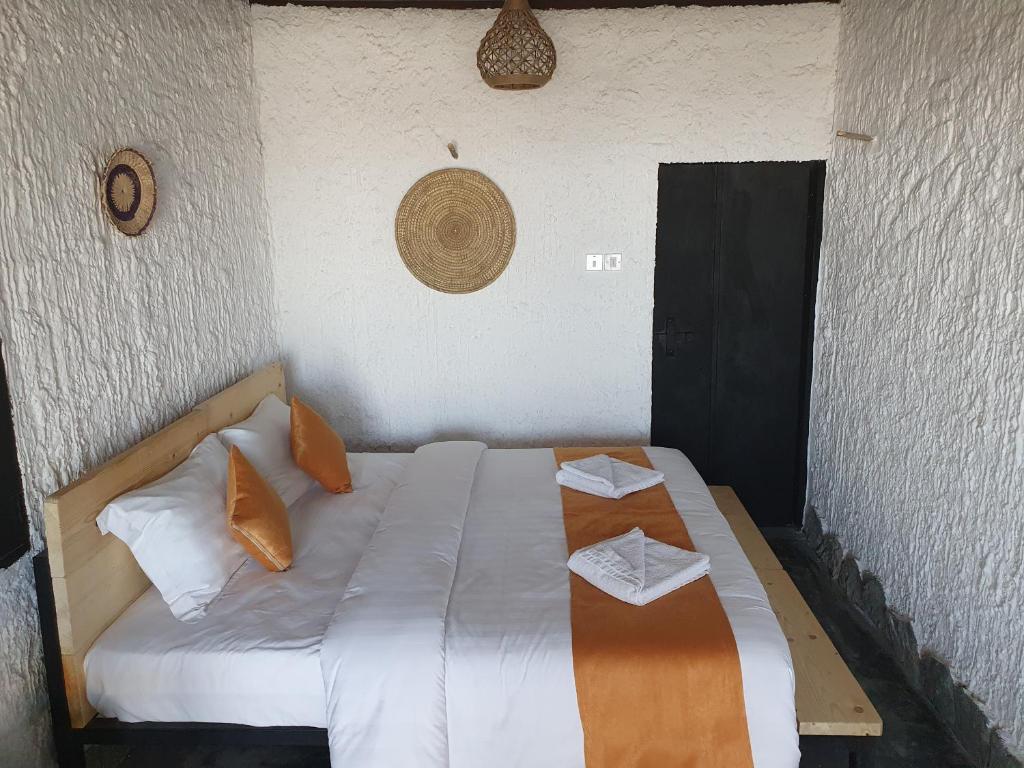 Postel nebo postele na pokoji v ubytování SAMA Al Khutaim-Heritage Home