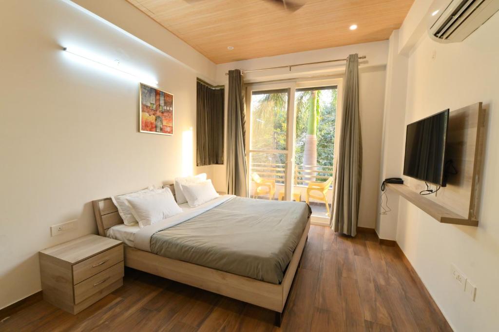 TV a/nebo společenská místnost v ubytování Stay Studio Hotel & Residences