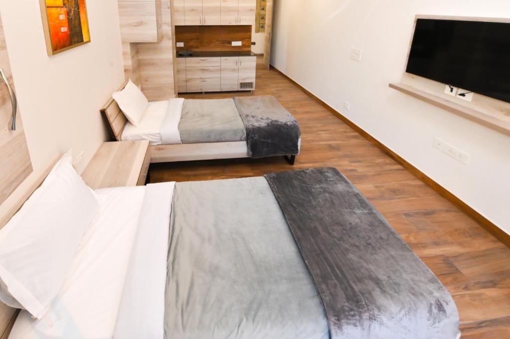 Postel nebo postele na pokoji v ubytování Stay Studio Hotel & Residences