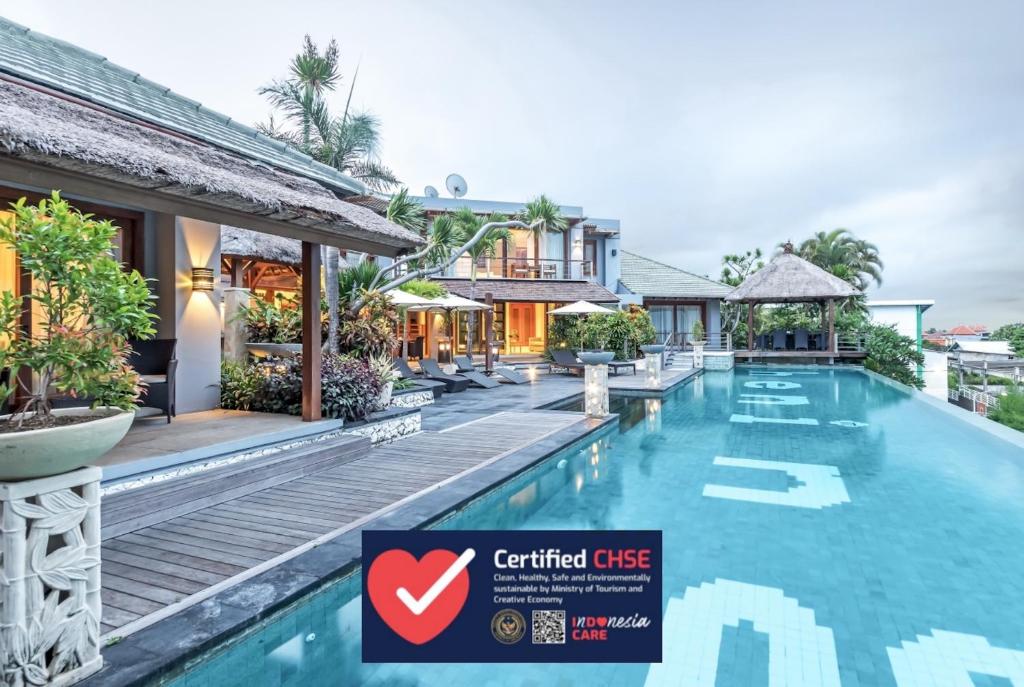 a view of the pool at the centennial gate hotel at Villa Hening Jimbaran in Jimbaran