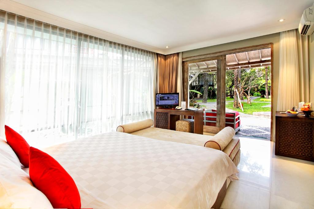Postel nebo postele na pokoji v ubytování Segara Village Hotel