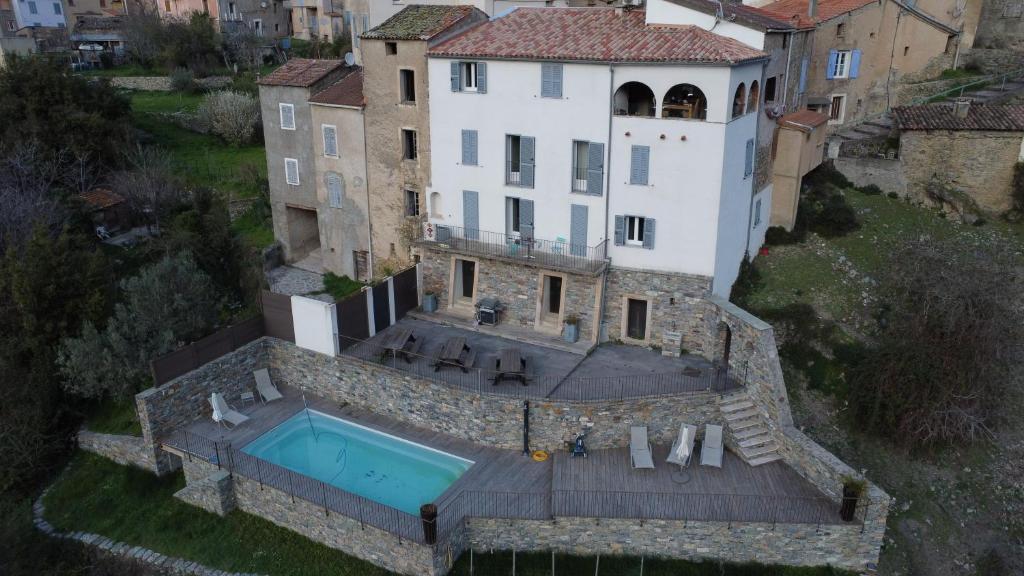 an aerial view of a house with a swimming pool at Saint Christophe in Omessa