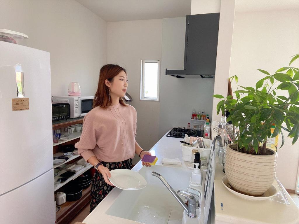 Kuchyň nebo kuchyňský kout v ubytování 2019新築 ! guest house Holoholo beach side