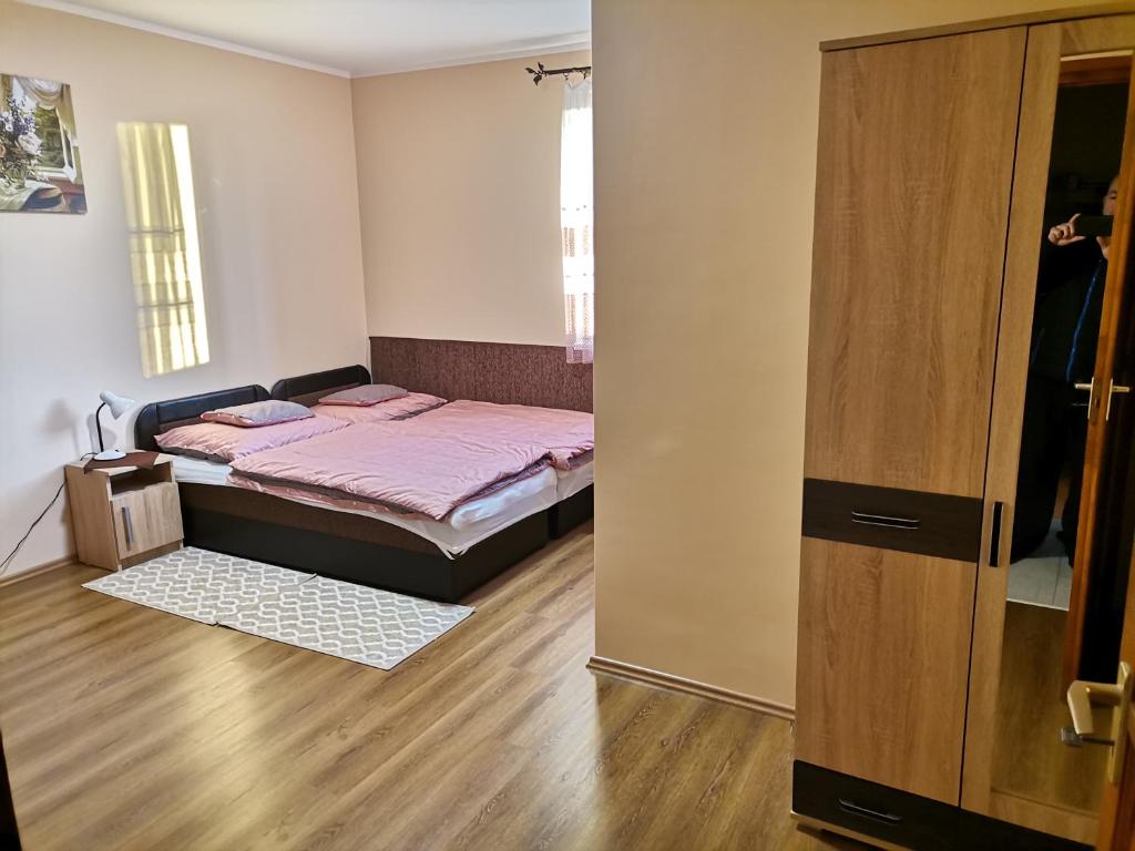 Postel nebo postele na pokoji v ubytování Ókerka Vendégház