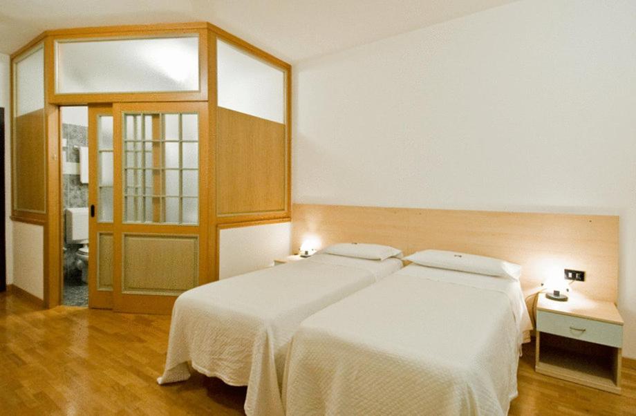 Postel nebo postele na pokoji v ubytování Hotel Europa