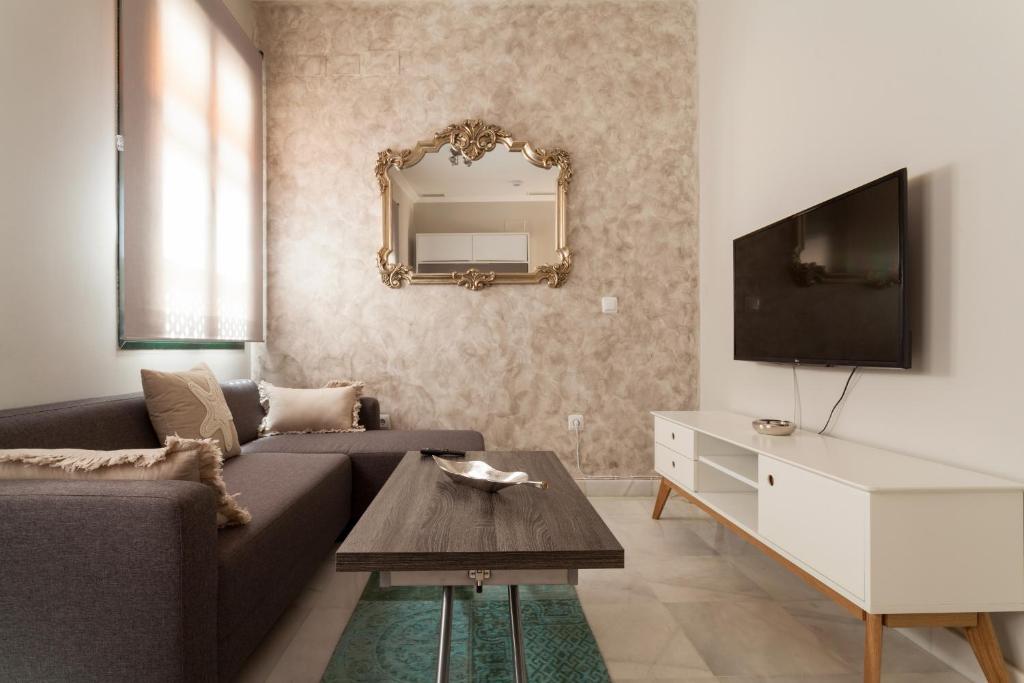 Televízia a/alebo spoločenská miestnosť v ubytovaní Dream Apartments calle Zaragoza