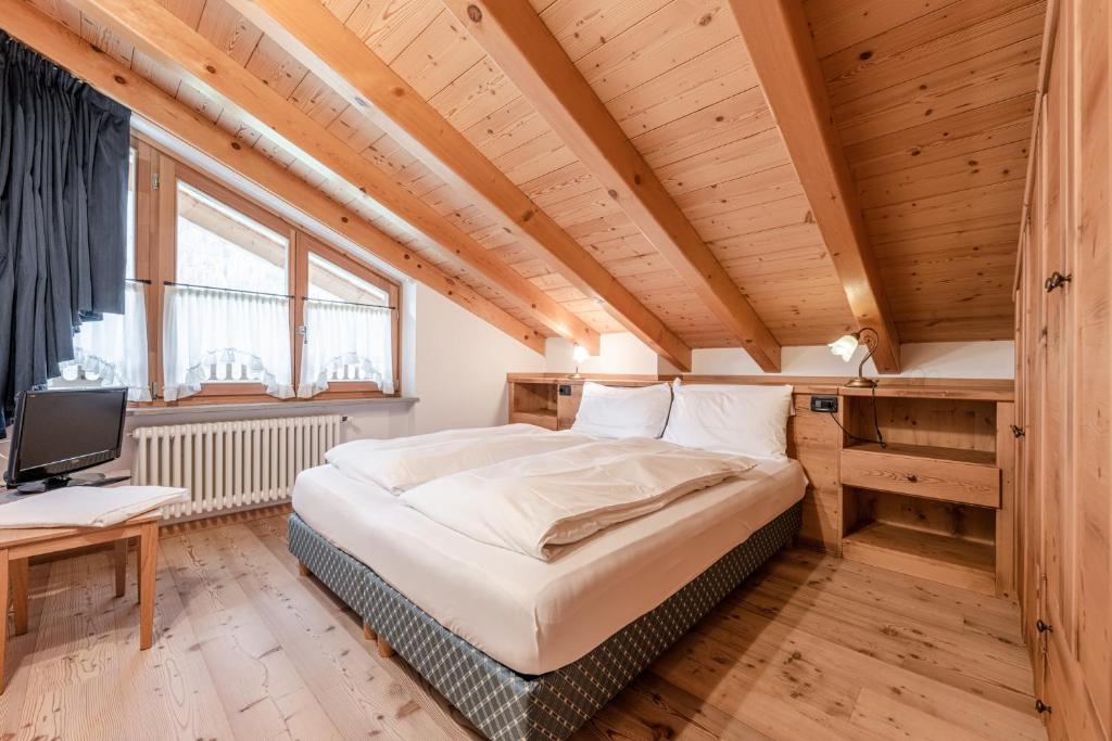 Un pat sau paturi într-o cameră la Maso Margherita