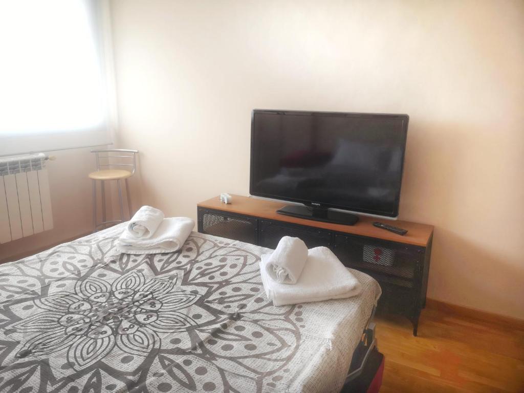 TV a/nebo společenská místnost v ubytování CLOIS, luanco centro