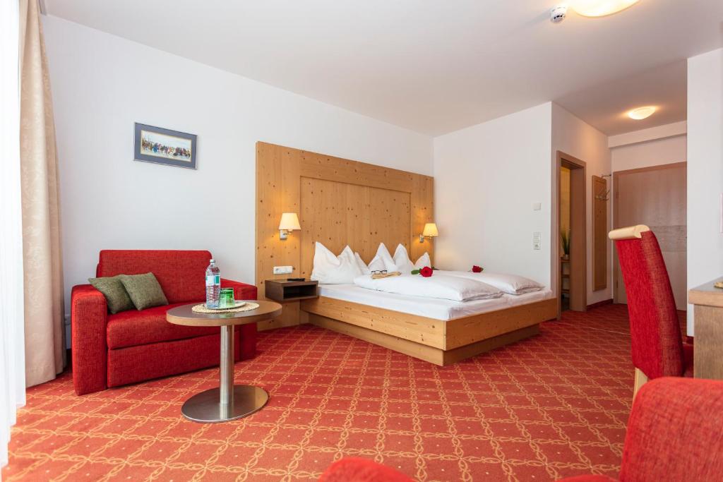 Postel nebo postele na pokoji v ubytování Klawunn Hotel & Apartement