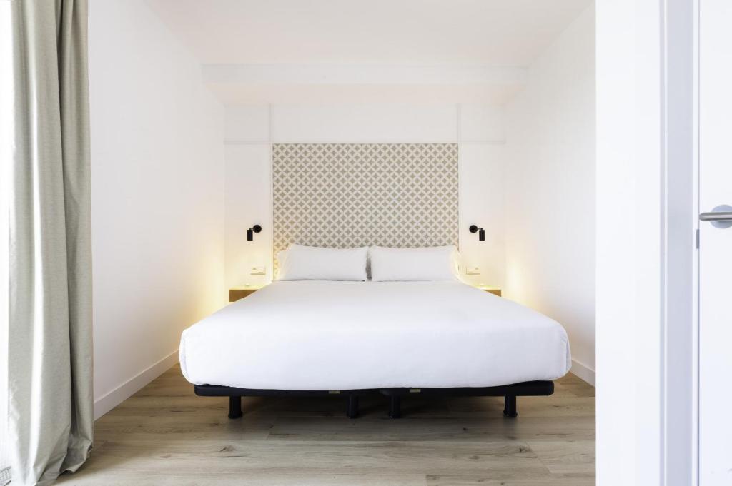 Posteľ alebo postele v izbe v ubytovaní Port Plaza Apartments