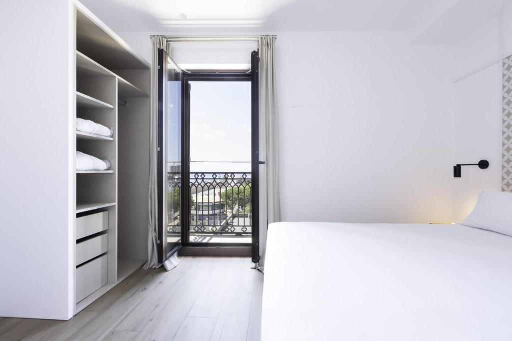 Posteľ alebo postele v izbe v ubytovaní Port Plaza Apartments