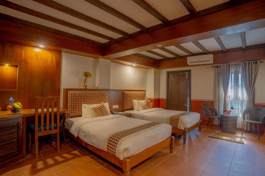 Postel nebo postele na pokoji v ubytování Pahan Chhen - Boutique Hotel