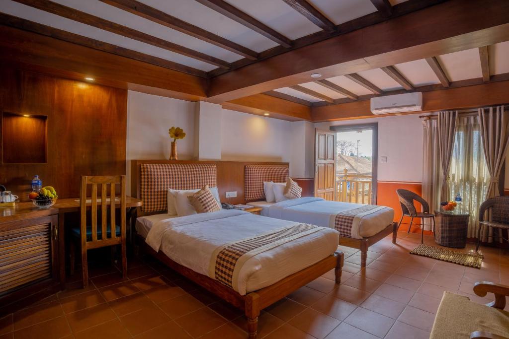 Postel nebo postele na pokoji v ubytování Pahan Chhen - Boutique Hotel