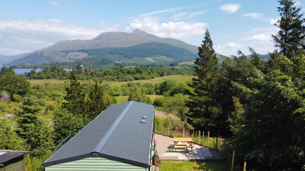 an overhead view of a house with a mountain in the background at Glen View in Taynuilt