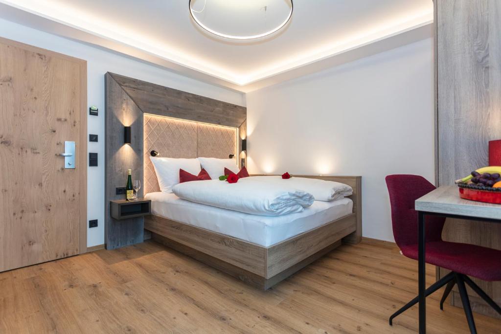 Postel nebo postele na pokoji v ubytování Klawunn Hotel & Apartement