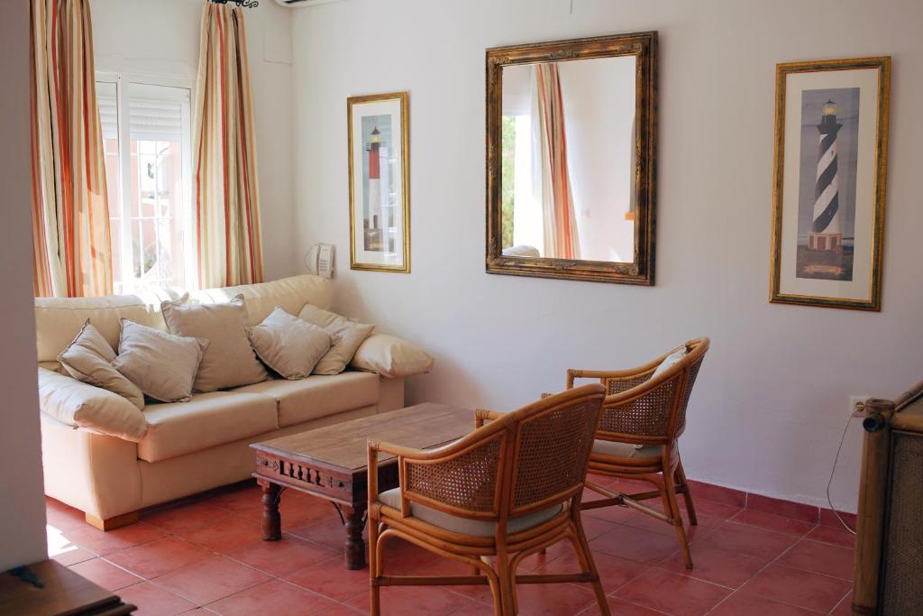 a living room with a couch and two chairs at Hotel Madreselva - Grupo Califa in Los Caños de Meca