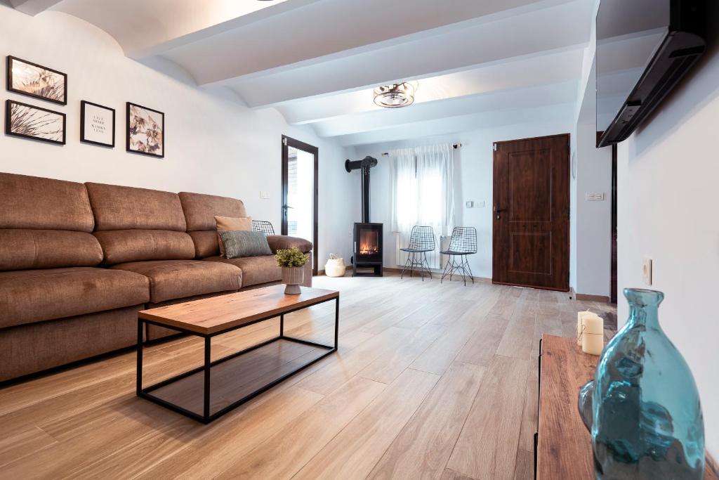 a living room with a couch and a table at Villa Maria in Murcia