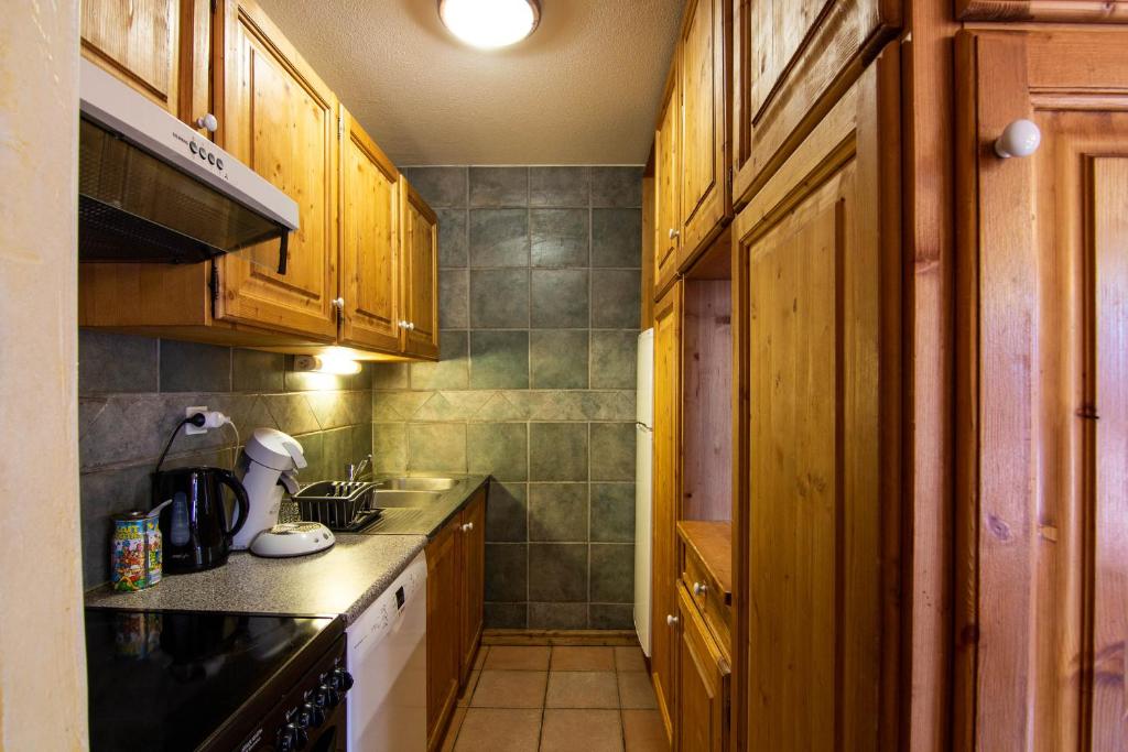 Kuchyň nebo kuchyňský kout v ubytování Balcons Appartements VTI