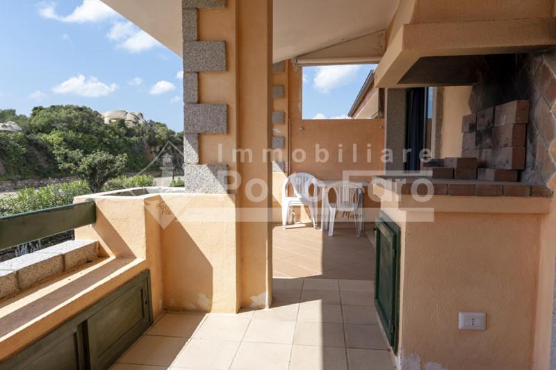 a view from the balcony of a villa with a view of the ocean at 18 BAIA FARO - Grazioso bilocale mansardato a Baia del Faro in Palau