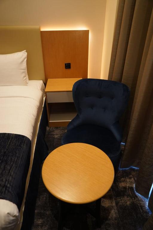 Postel nebo postele na pokoji v ubytování AL HAYAT HOTEL