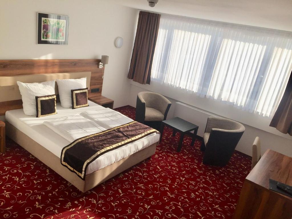 Postel nebo postele na pokoji v ubytování Hotel Luna