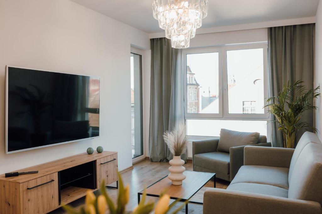 Telewizja i/lub zestaw kina domowego w obiekcie Złote Apartamenty 58