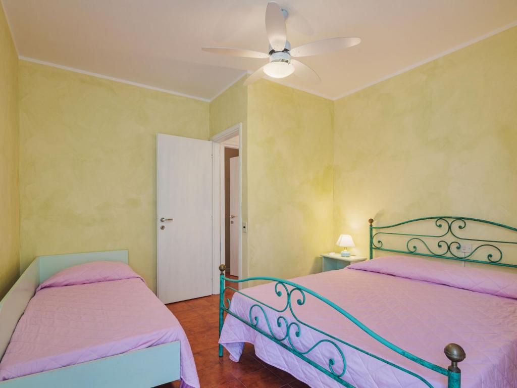 Posteľ alebo postele v izbe v ubytovaní Apartment La Rocchetta by Interhome