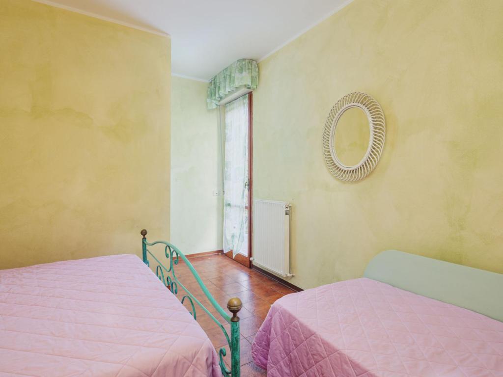 Posteľ alebo postele v izbe v ubytovaní Apartment La Rocchetta by Interhome