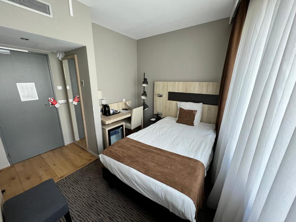 Postel nebo postele na pokoji v ubytování Best Western Hotel Royal Centre
