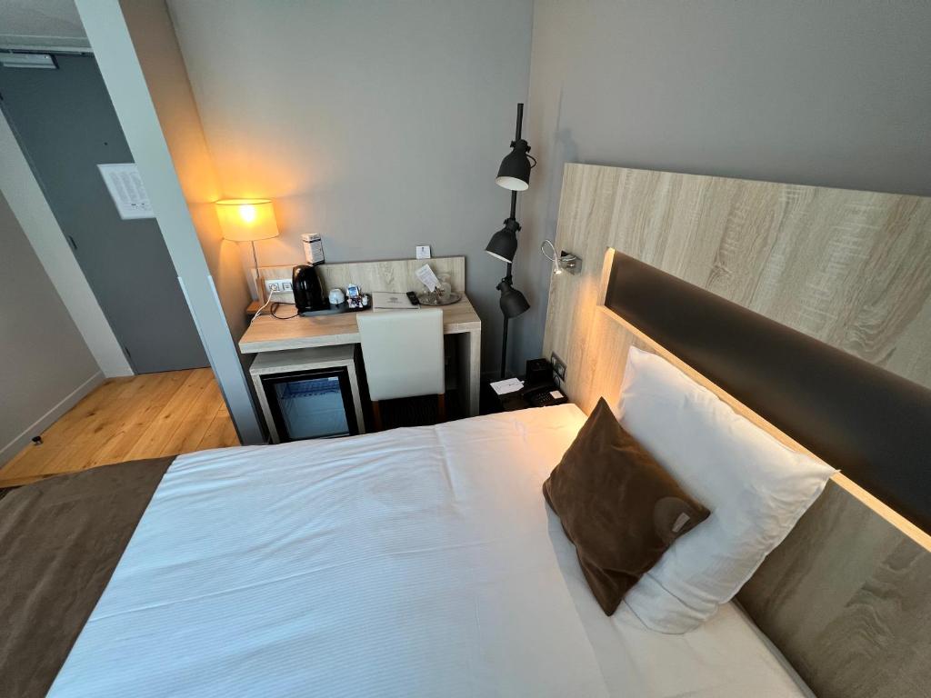 Postel nebo postele na pokoji v ubytování Best Western Hotel Royal Centre