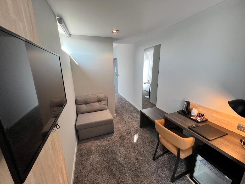 TV a/nebo společenská místnost v ubytování Best Western Hotel Royal Centre