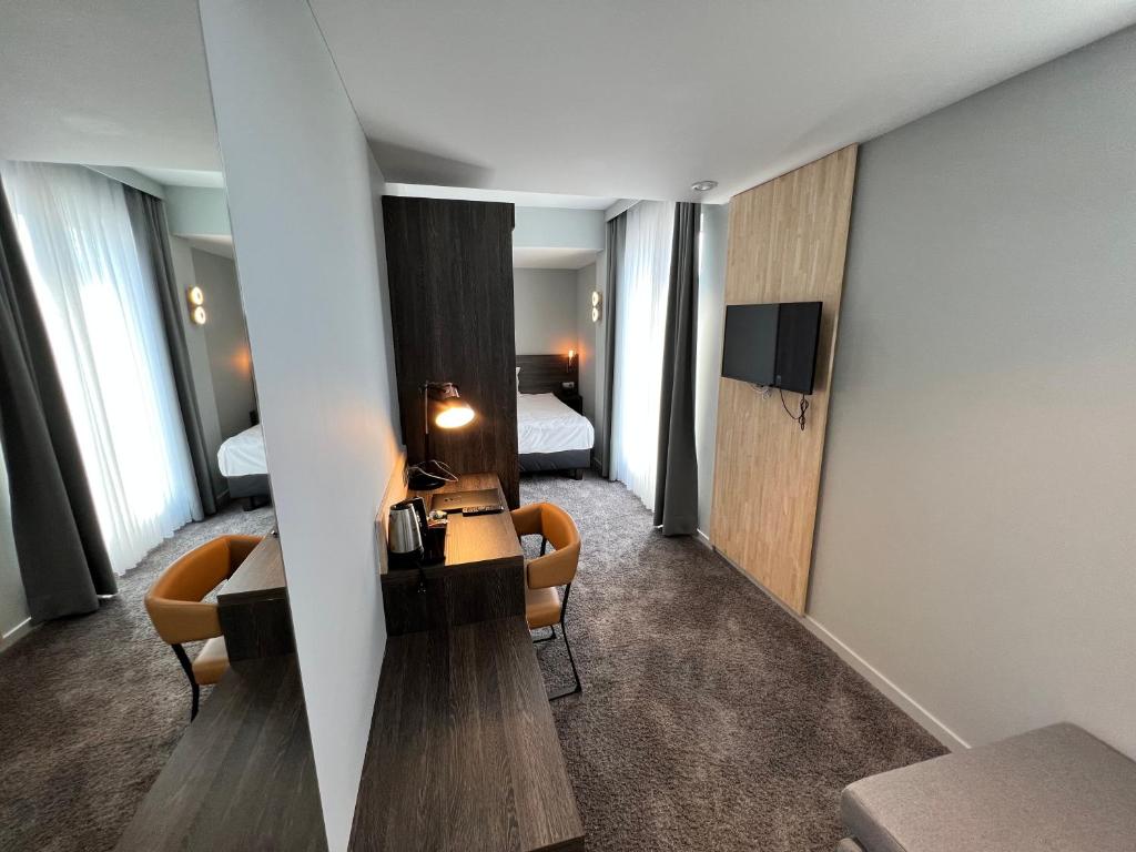 TV a/nebo společenská místnost v ubytování Best Western Hotel Royal Centre