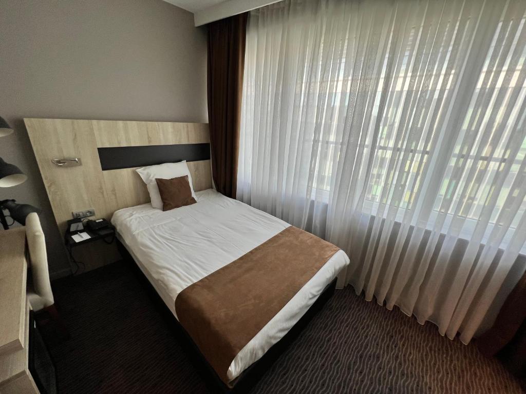 Postel nebo postele na pokoji v ubytování Best Western Hotel Royal Centre
