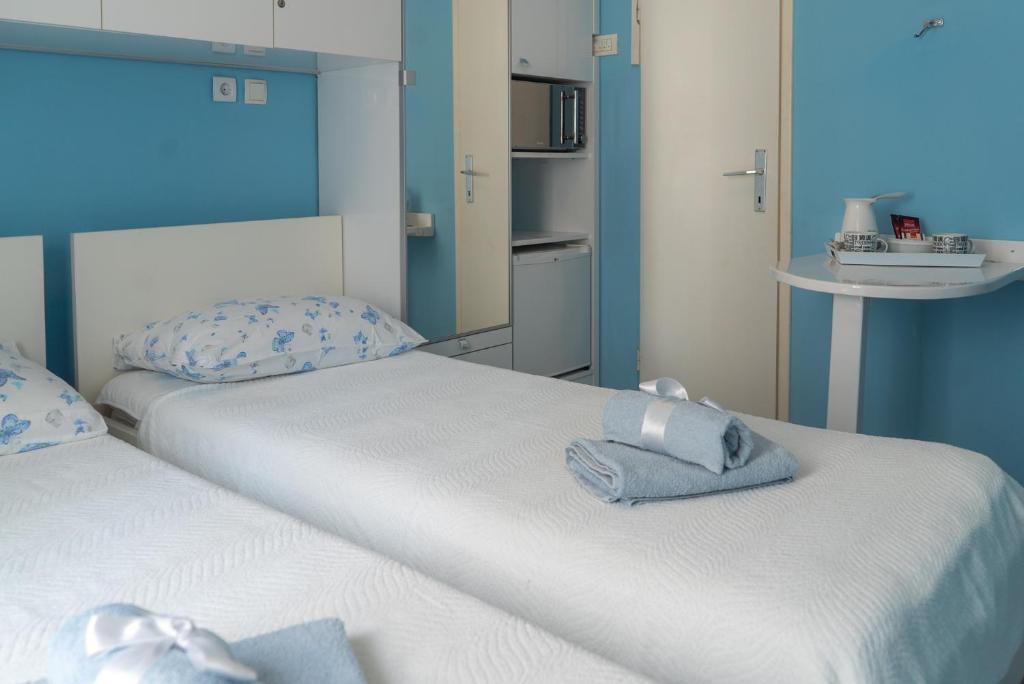 Postel nebo postele na pokoji v ubytování Apartments & Rooms Andrea 2