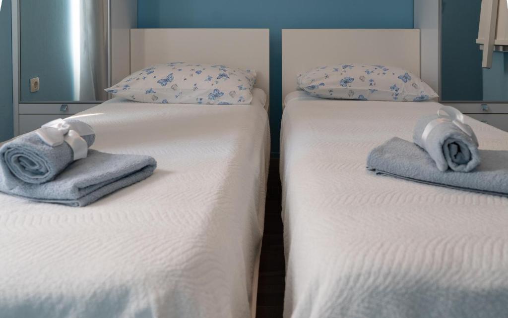 Postel nebo postele na pokoji v ubytování Apartments & Rooms Andrea 2