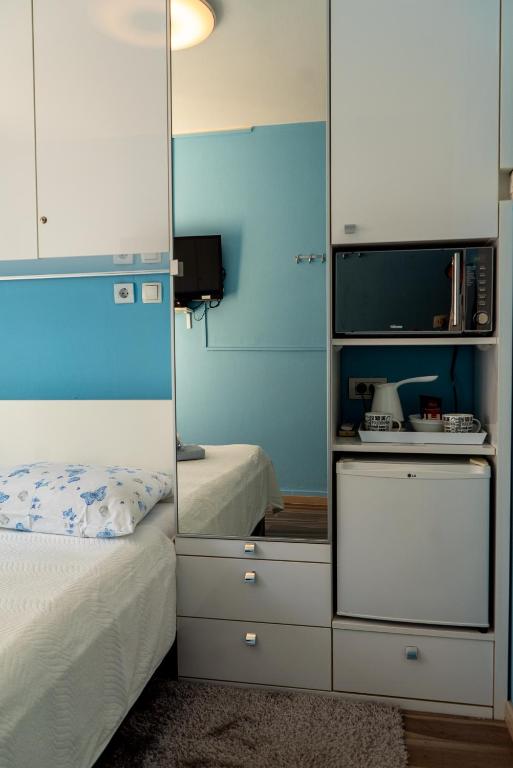 Postel nebo postele na pokoji v ubytování Apartments & Rooms Andrea 2