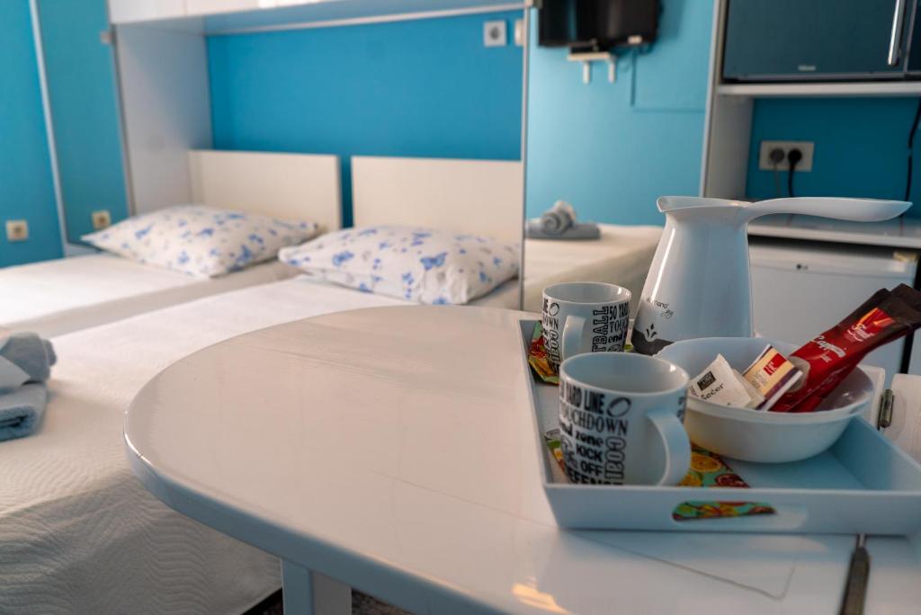 Postel nebo postele na pokoji v ubytování Apartments & Rooms Andrea 2