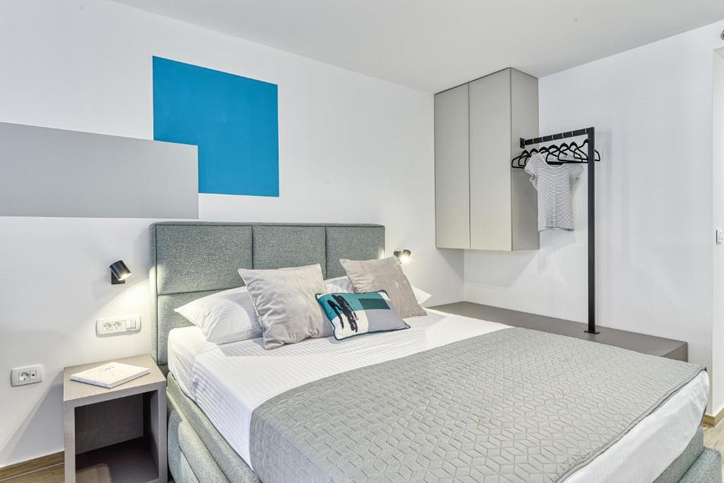 Posteľ alebo postele v izbe v ubytovaní Apartments Hica